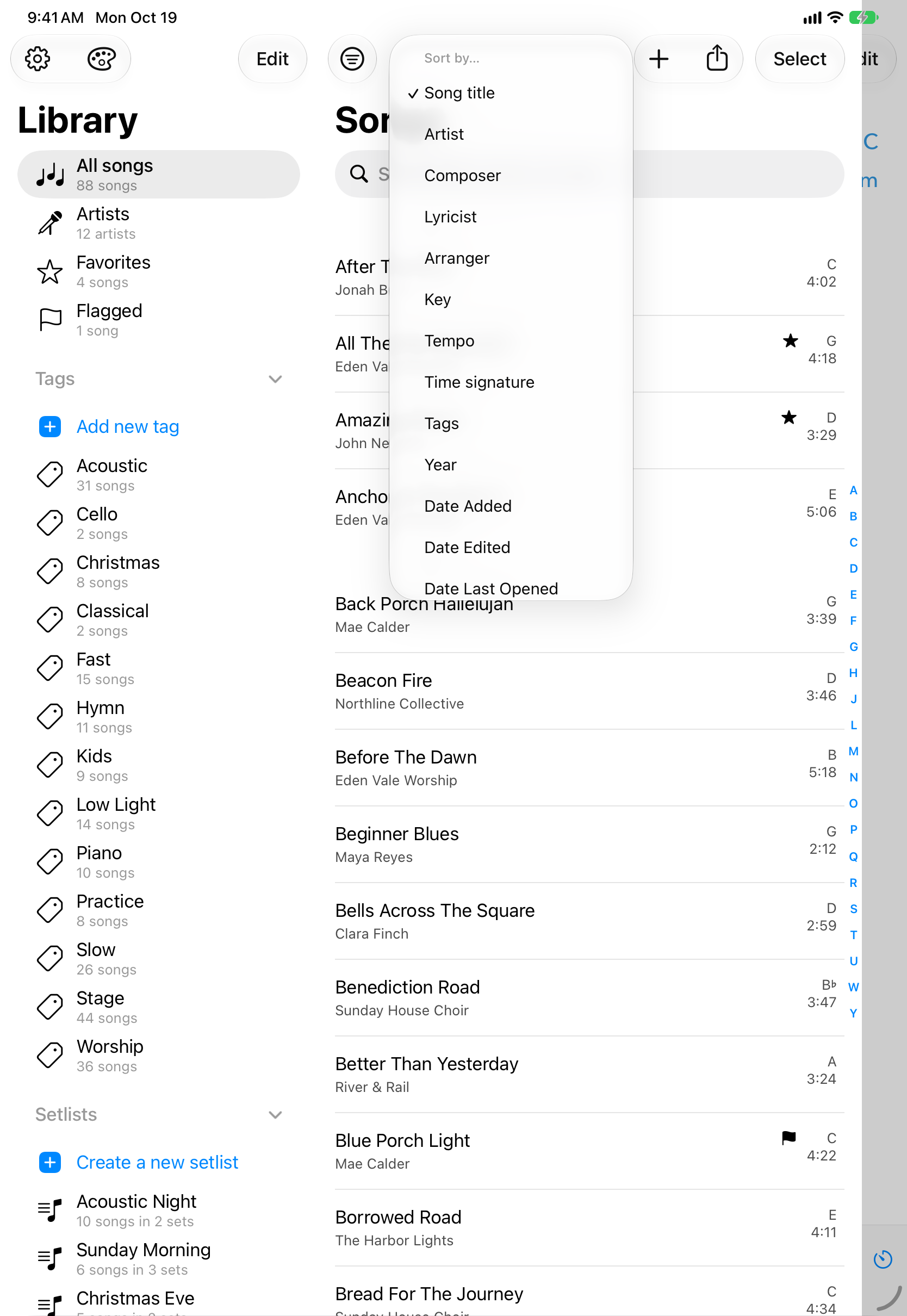 Menu de ordenação da biblioteca aberto sobre a lista de músicas, com Título da música selecionado e, abaixo dele, as opções Artista, Compositor, Letrista, Arranjador, Tom, Andamento, Fórmula de compasso, Tags, Ano e datas